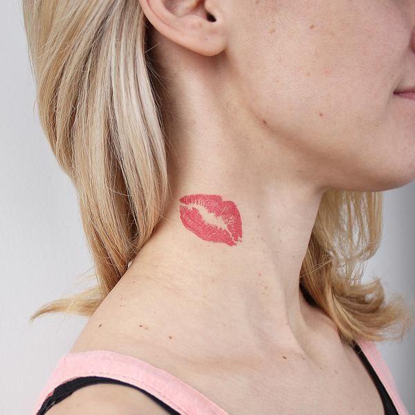 Tattoo of lips on neck.