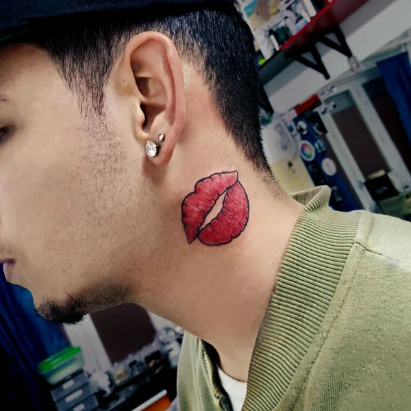 Tattoo of lips on neck.