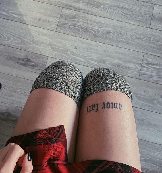 Above Knee Tattoo.
