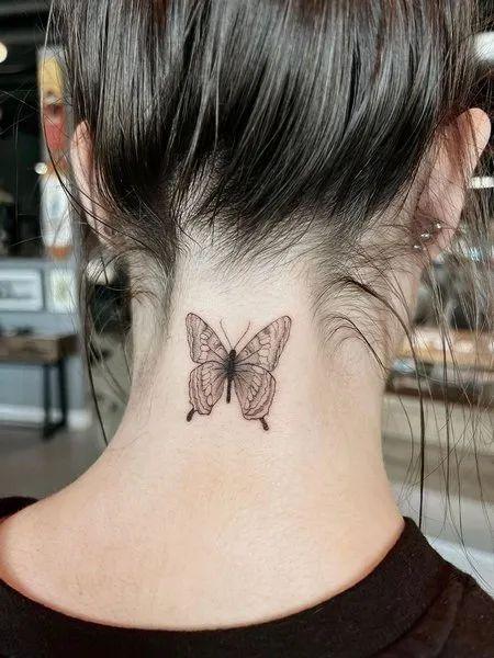 Butterfly Neck Tattoo.