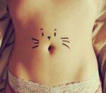 Cat tattoo on belly button