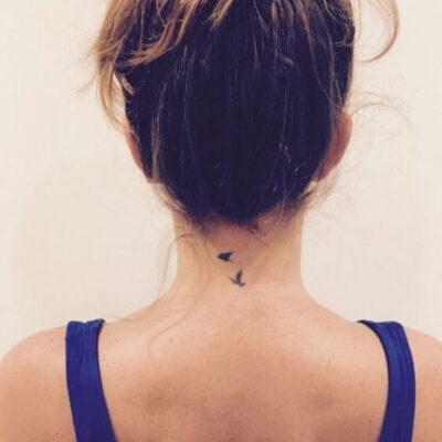 Bird neck tattoo